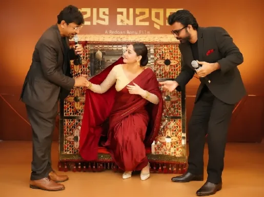 Afran Nisho and Chanchal Chowdhury helping Puja Cherry step down from a palanquin at the mahurat ceremony of Domm